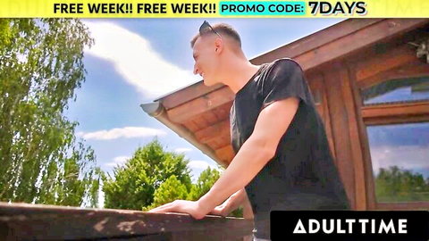 Charlie Dean outdoors on porch in black tee, AdultTime promo with Lia Lin foot worship