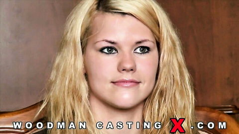 Young blonde with green eyes smiling in Woodman casting couch POV interview