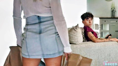 Aderes Quin in sheer top and mini skirt, teasing from behind on couch