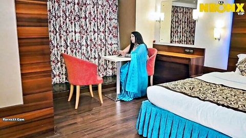 Indian bhabhi Smitapaul in blue saree, sitting seductively in hotel room, NeonX uncut short film