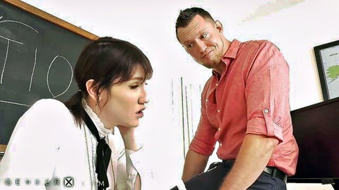 Lena Moon as brunette teacher in white blouse talking to man after class