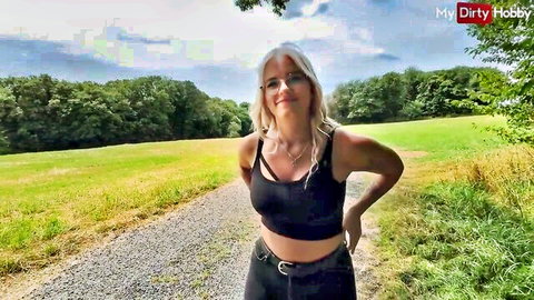 Blonde babe with glasses teases underboob in tight black crop top outdoors in forest