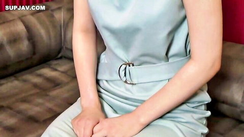 Asian clerk in sexy blue dress sitting, ready to strip at store