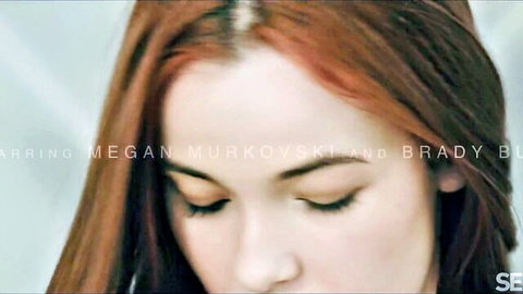 Megan Murkovski close-up portrait, red hair, erotic gaze for sexy leg play video