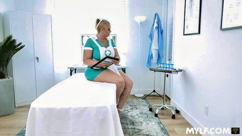 Blonde MILF nurse in short sexy uniform sitting on exam table holding tablet