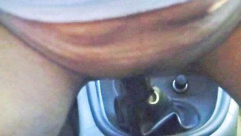 Mature blonde woman spreads legs over gear shift in car POV tease
