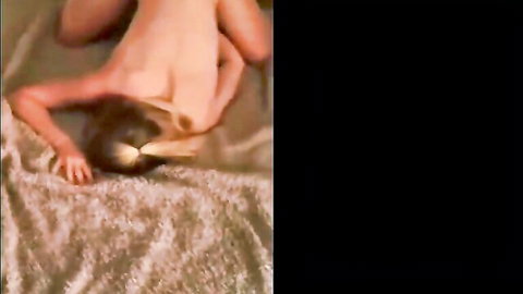 Naked white MILF upside down on bed, legs spread wide