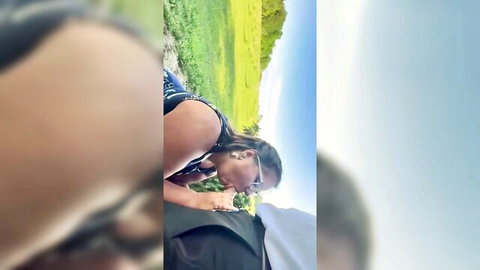 Curvy Black MILF in sunglasses leans forward outdoors, teasing in nature