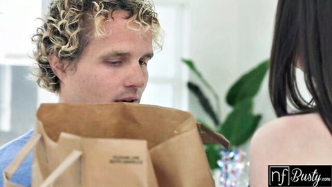 Alyx Star in blue top gets a bag from man in Fourth of July threesome tease