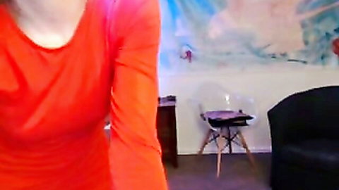 Red-hot camgirl in orange top teases butt play with huge dildo
