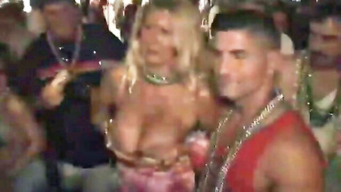 Blonde babe flashing huge bare tits and nipples at crowded wild party with muscular guys groping her
