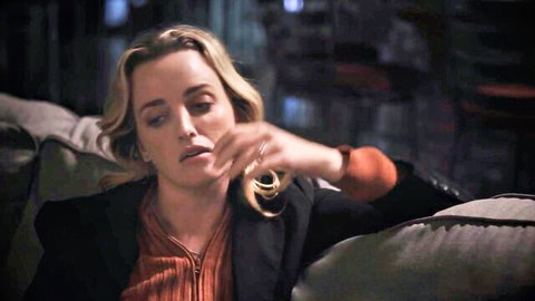 Charlie Forde seductive blonde in blazer, smoking pose from hardcore threesome