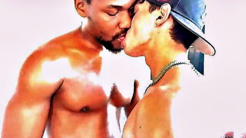 Muscular ebony hunk passionately kissing Latino stud wearing backwards cap