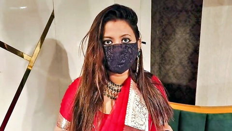 Sexy Indian stepmom in red saree and black mask, seductive gaze