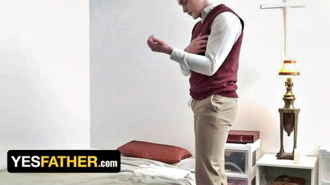 Priest Jack Hunter in red vest stands seductively in church room