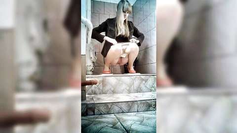 Pale blonde babe squatting in restroom, exposing pussy from front voyeur view