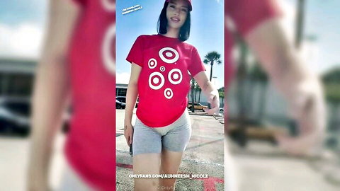 Anessh Nichols teases in red Target tee and gray shorts outdoors