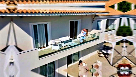 Sonya Blaze embraces Jack Rippher on sunny balcony in Blacked interracial scene