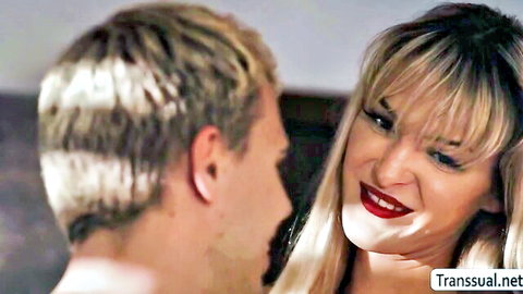 Tori Easton close-up with guy in intimate gaze, trans domination tease