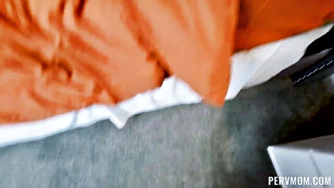Curvy big ass brunette in black thong bent over orange bed teasing