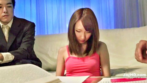 Rika Anna in pink top with suited man in JAV seduction scene