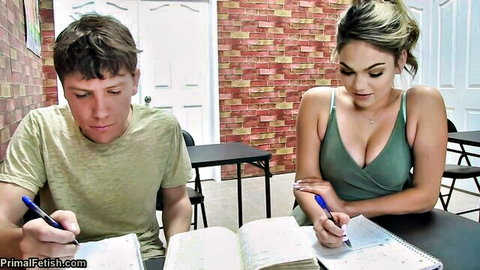 Blonde teen in deep cleavage top studies with young guy in classroom teasing big tits