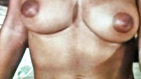 Vintage close-up of black hottie's natural big tits and nipples