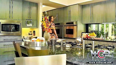 Maddy in tight dress teasing her ass in kitchen