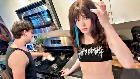 Goth e-girl in slayer crop top seduces guy cooking in kitchen with teasing pose