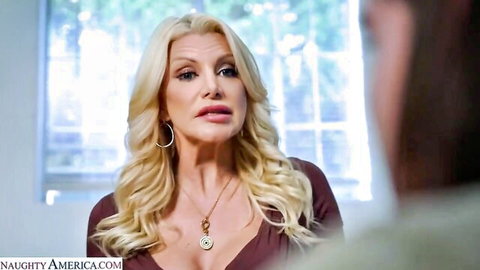 Blonde MILF Brittany Andrews in maroon top, big tits, expressive dirty talk roleplay