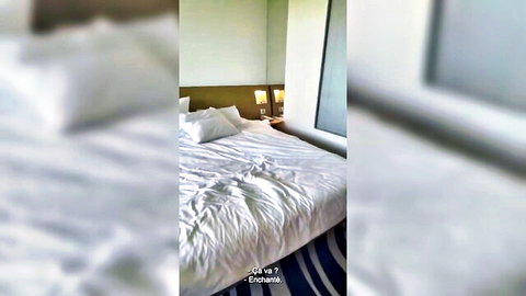 Blurry rumpled white bed sheets in modern hotel bedroom after steamy sex