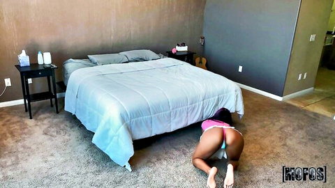 Athletic black teen on all fours exposing shaved pussy and ass with pink thong pulled aside on bedroom floor