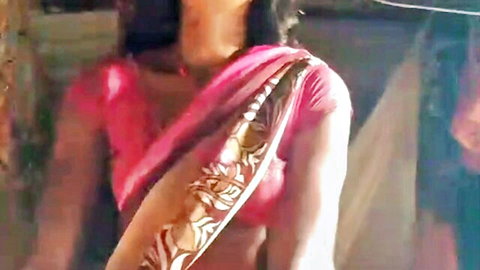 Sexy Indian housewife in pink saree with deep cleavage tease