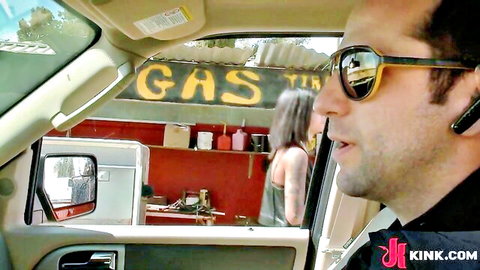 Bonnie Rotten in teasing outdoor pose at gas station with voyeuristic man