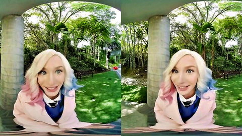 Emma Rosie as furry werewolf Enid in pink blazer, smiling cosplay pose