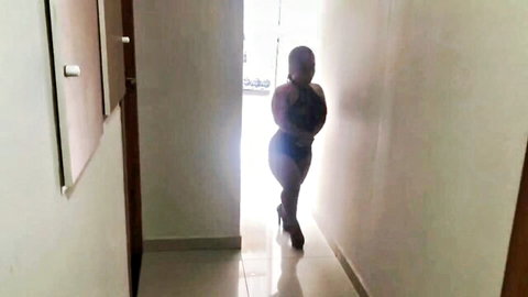Anazinha do Mau, curvy dwarf in tight black outfit and heels posing seductively