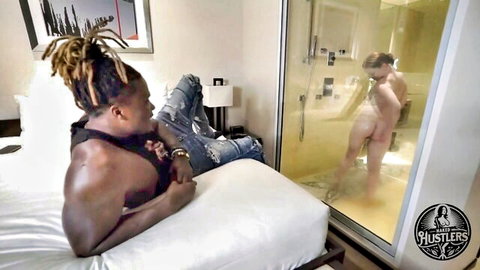 Petite ebony with fiery red hair nude in shower, watched by muscular black stud