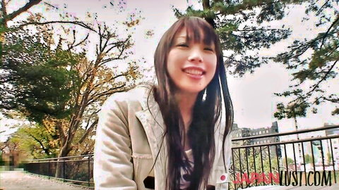 Stunning Japanese university girl Japan Lust Gold smiling outdoors in casual jacket