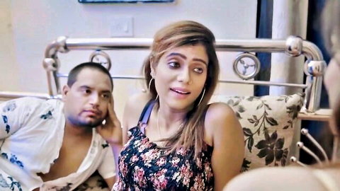 Indian girlfriend in floral dress teases with boyfriend on bed, hot threesome preview