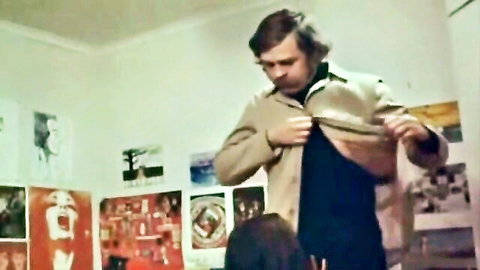 Shaggy-haired man opening jacket to brunette in steamy MILF teen couple scene