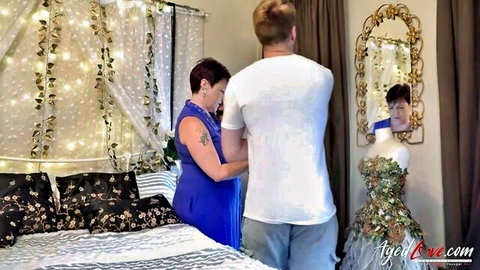 Layla helps Chris into sparkling green dress before mature play