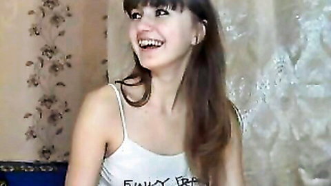 Seductive Russian babe in tank top smiling, ready to finger and toy her wet pussy