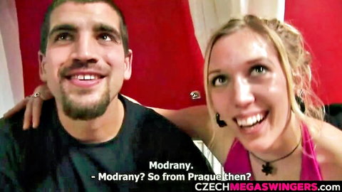 Smiling Czech couple from Prague in swinger party, natural tits visible