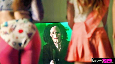 Myra Moans and Megan Marx in sexy Halloween strip game watching Jigsaw
