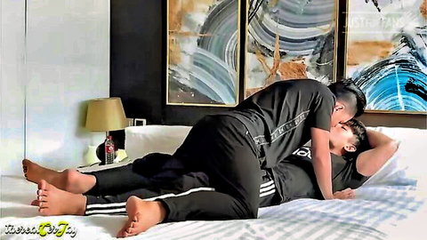 Thai models Kadder and Cejay in passionate clothed embrace