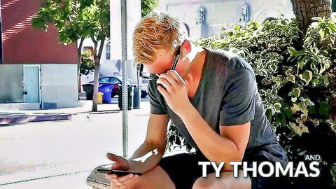 Ty Thomas outdoors in park, athletic blonde guy in t-shirt and shorts posing