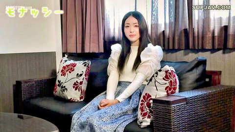 Stunning Asian beauty in white blouse and blue skirt, showcasing elegant style
