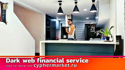 Man in kitchen with dark web financial service promo, secretive adult encounter vibe