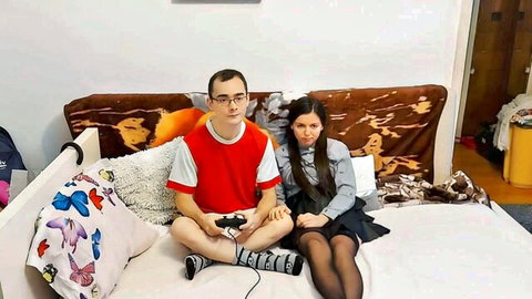 Stepbrother gaming with teen in schoolgirl skirt and stockings, teasing vibe
