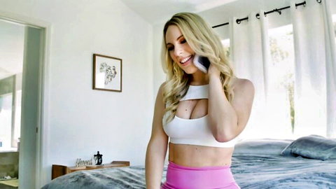 Blonde Bunny Madison in sexy white cutout top and pink shorts on phone call